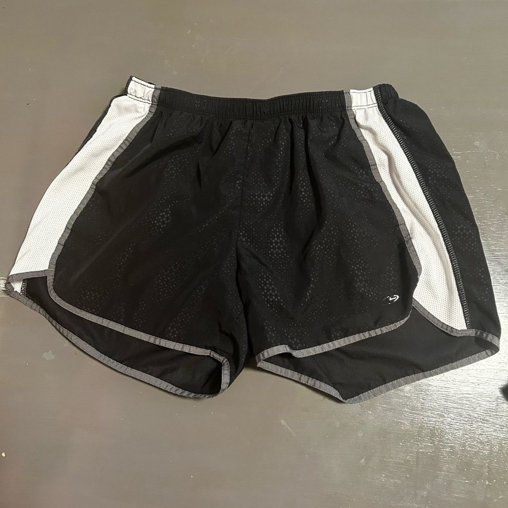 Black, white, and gray Champion running shorts